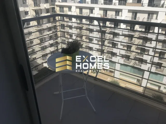 a person standing on a ledge with a skateboard