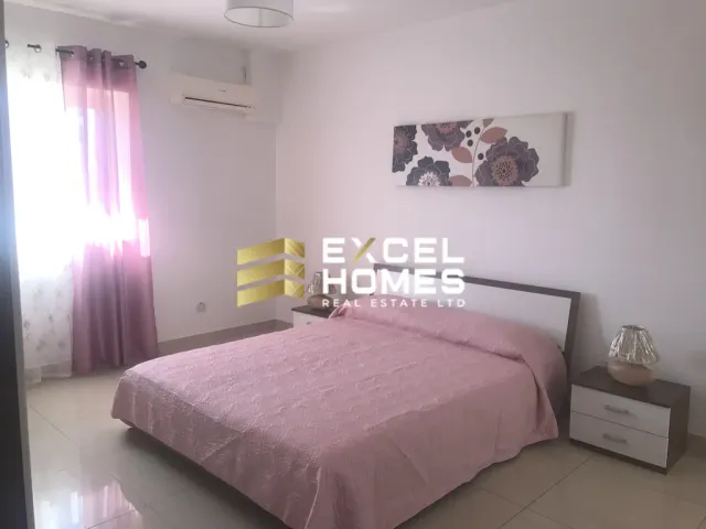 a bedroom with a bed, a lamp, and a wall mounted wall mounted wall mounted wall mounted wall mounted wall mounted wall mounted wall mounted wall mounted wall mounted wall mounted wall mounted wall mounted wall mounted wall mounted wall mounted wall mounted wall mounted wall mounted wall