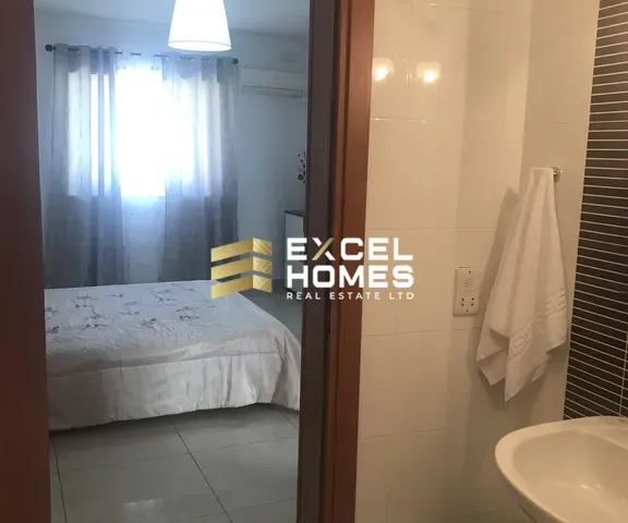 a bathroom with a shower, sink, and toilet