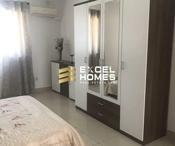 a bedroom with a mirror and a bed