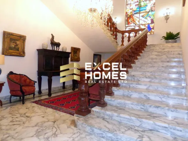 a large staircase leading up to a living room 