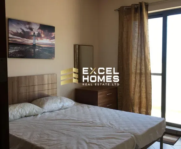 a bed with a picture of a man on it