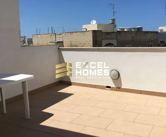 a toilet sitting next to a wall with graffiti on it