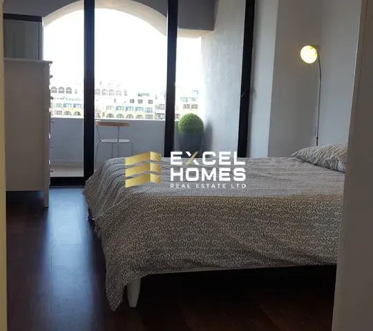 a bed room with a bed and a window