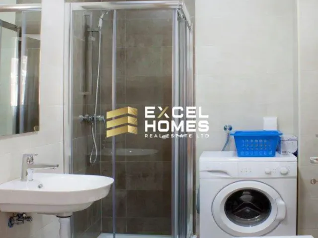 a bathroom with a shower, toilet and sink