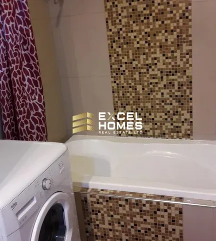 a bath tub sitting next to a toilet