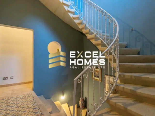 a person standing on a stairway with a stair case