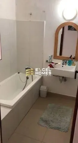 a bath tub sitting next to a toilet