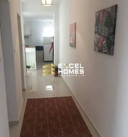 a bathroom with a toilet and a door