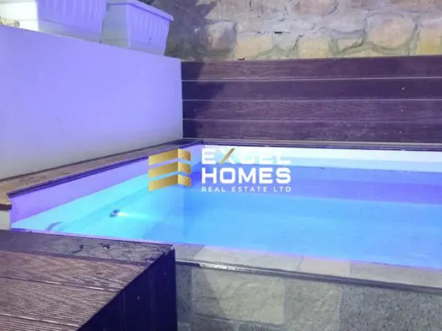 a blue and white swimming pool with a blue sign