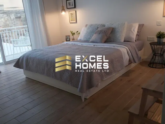 a bed with a white bedspread and a white bedspread