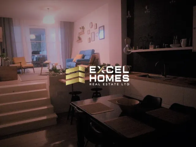 a living room with a table and chairs