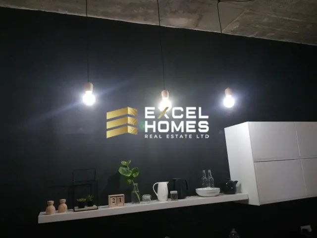 a large white light fixture in a dark room