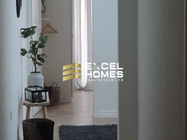 a small room with a door and a plant