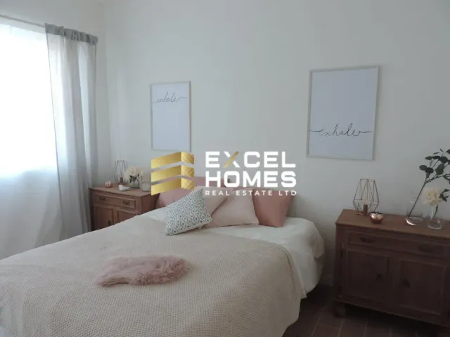 a bed with a white bedspread and a white bedspread