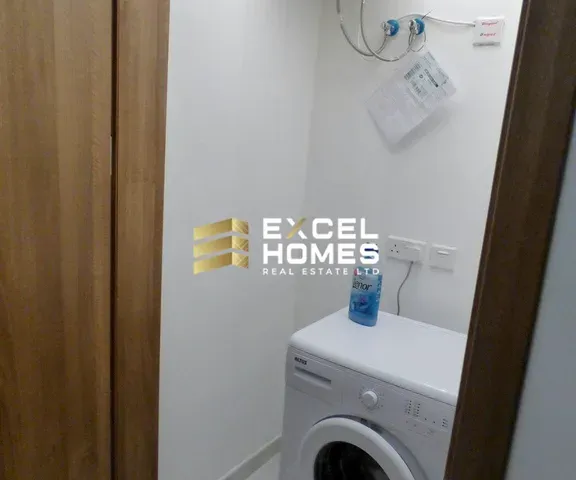 a white toilet sitting next to a white sink