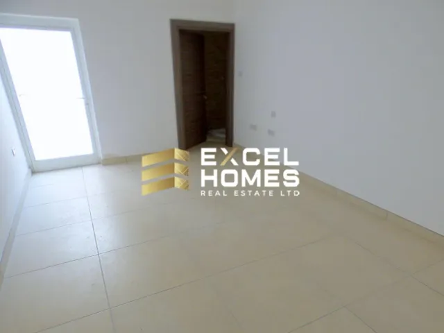 a room with a white wall and a white floor 