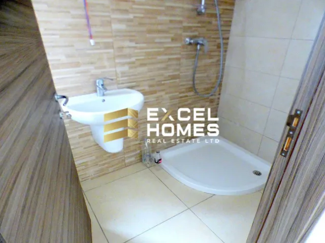 a bathroom with a toilet and a sink 