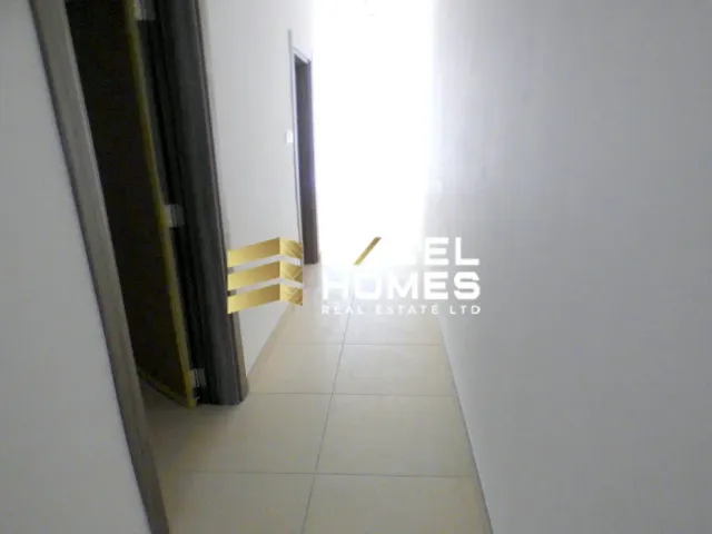 a white toilet sitting next to a doorway 