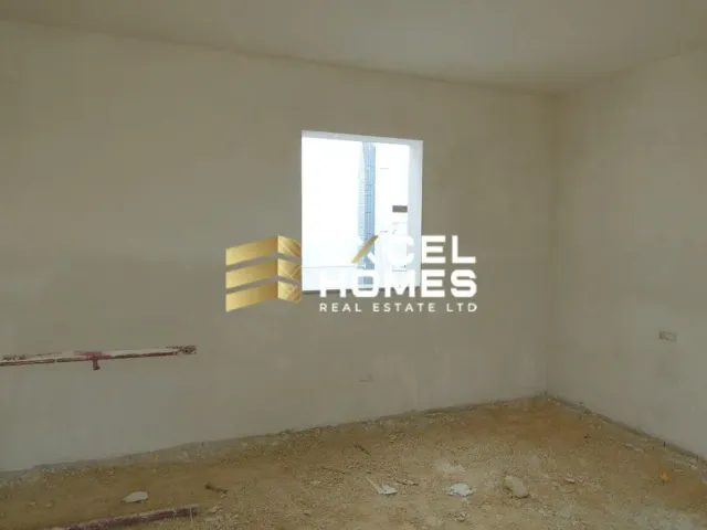 a room with a wall and a wall with a window