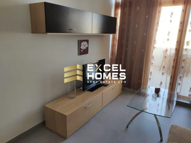 a room with a desk and a lamp