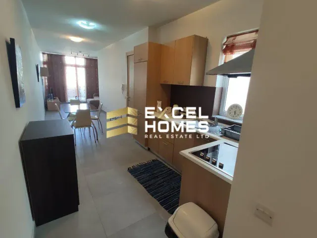 a kitchen with a stove, sink, and refrigerator