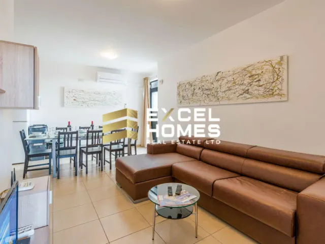 a living room with a couch, chairs, and a table