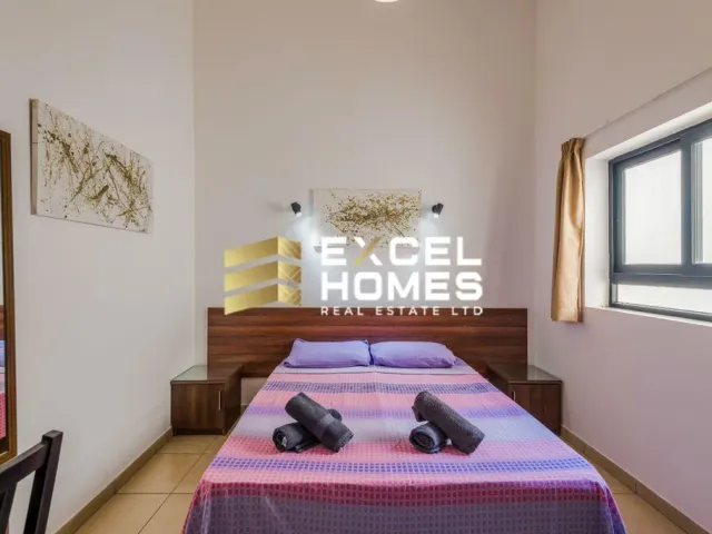 a bed room with a bed with a blue wall 