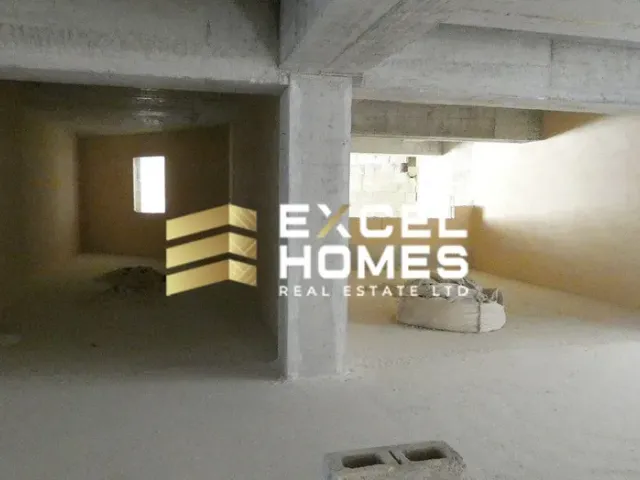 a room with a wall and a toilet