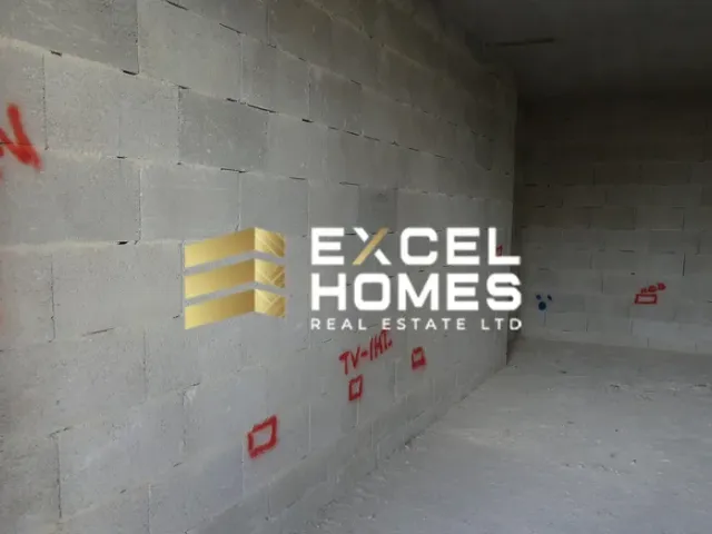 a wall with a poster of a man in a red shirt