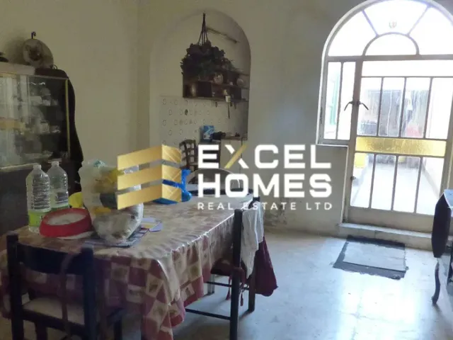 a kitchen with a table and chairs and a window