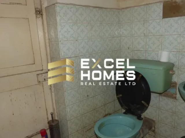 a toilet with a picture of a man in it