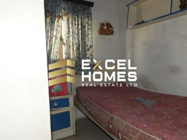 a bed room with a bed and a wall