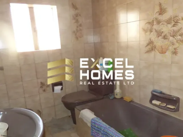 a bathroom with a toilet and a sink