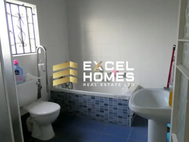 a bathroom with a toilet and a sink