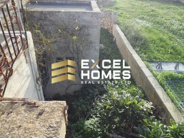 a wall with a sign that says "no trespassing"