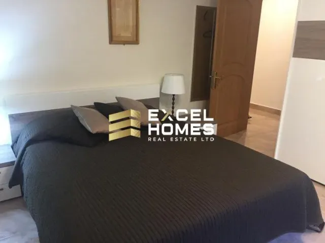 a bed with a book and a pillow on it