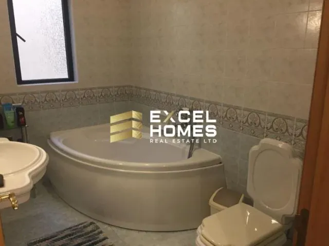 a bathroom with a toilet and a bathtub