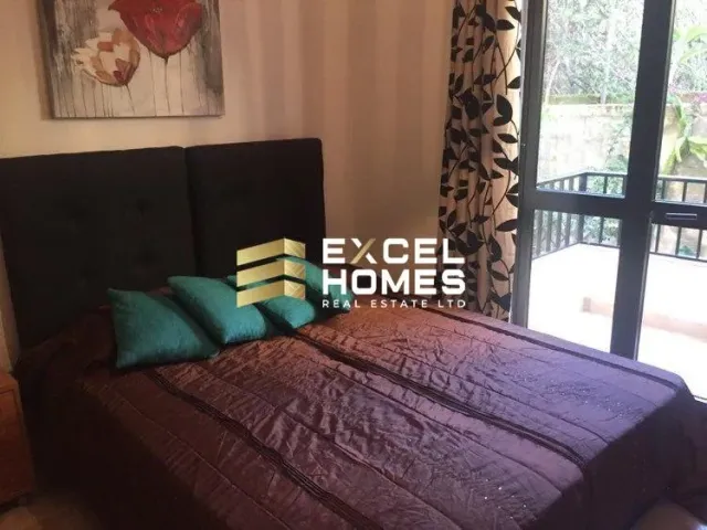 a bed with a blue blanket and a blue comforter