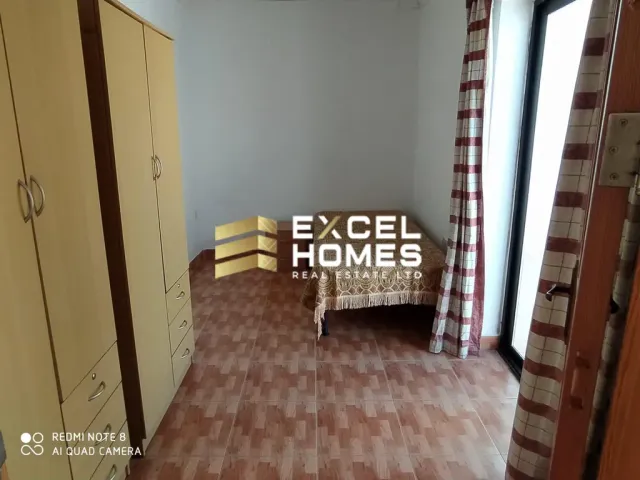 a room with a couch and a chair