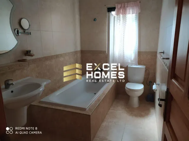 a bathroom with a toilet, sink, and bathtub