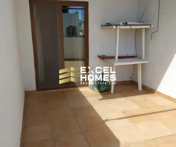 a room with a door open and a window