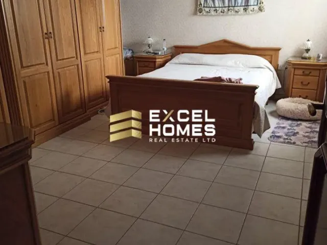 a bed with a white bedspread and a black bedspread 