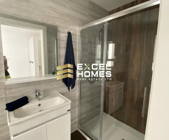 a bathroom with a sink, mirror, and bath tub