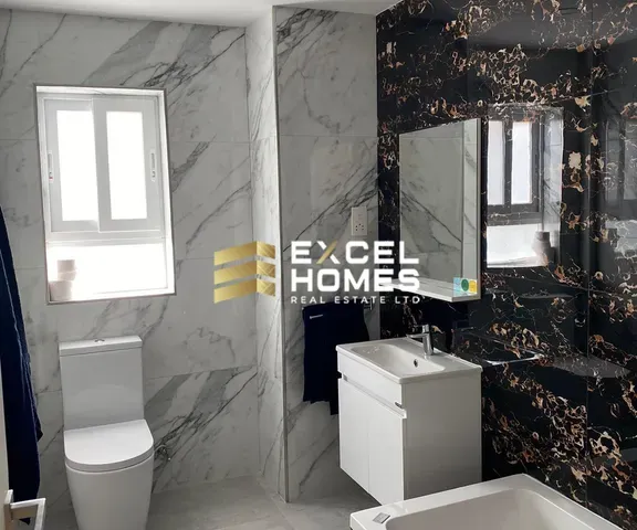 a bathroom with a toilet and a sink