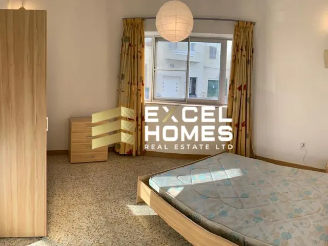 a bed room with a bed and a desk