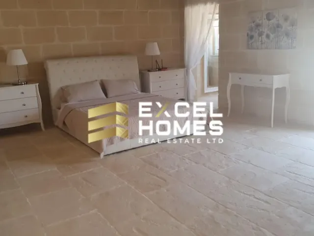 a bed with a white bedspread and a white bedspread