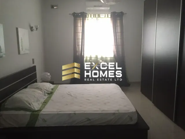 a bed with a white bedspread and a white bedspread