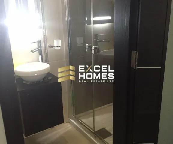 a bathroom with a mirror and a toilet