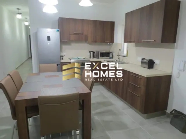 a kitchen with a refrigerator, stove, sink and a microwave